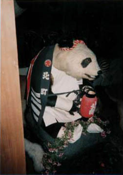 Panda wearing a Happi coat