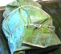Image of tamales in banana leaves