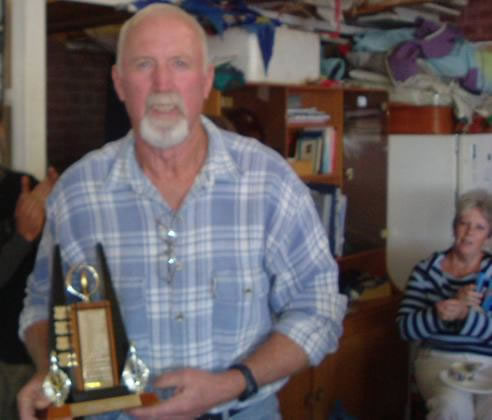 Darcy won this perpetual trophy. His wife Anne looks on