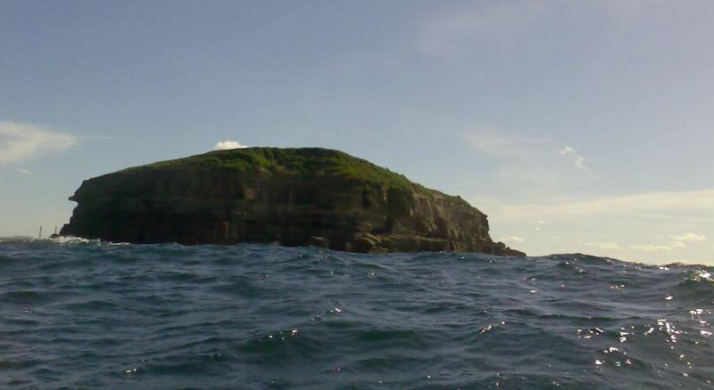 Bottom of island obscured by swell