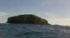 Bottom of island obscured by swell (35kb)