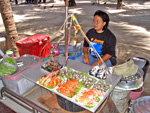 warm seafood is available on the side of the walking lane