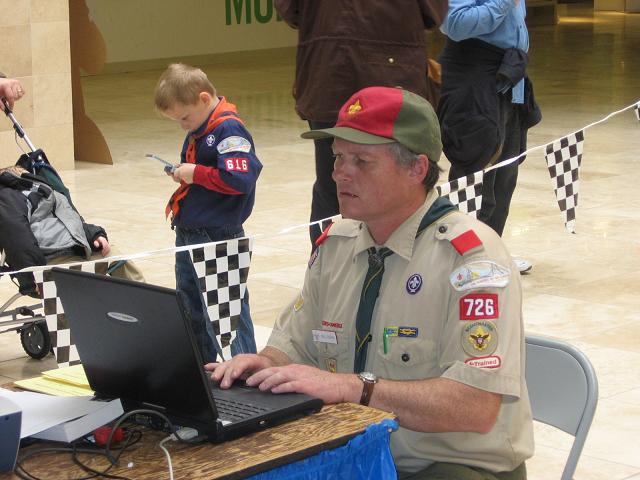 Scoutmaster Neil Guerin leading the Pinewood Derby for another year