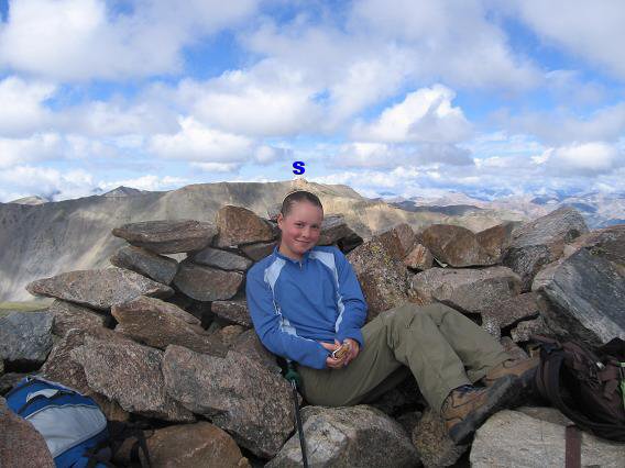Victoria on the summit of Mt Oxford with the summit of Mt Belford behind her in the distance