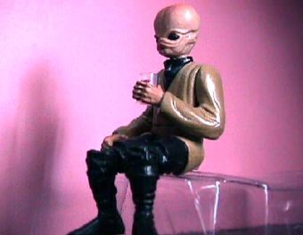 The figure in a sitting position.