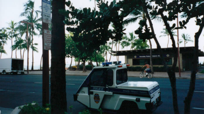 Typical police vehicle in Waikiki right on Waikiki Beach.