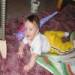 This is a picture of my son, taken in April of 2003. There was absolutely nothing around to cause the little orb moving about behind my son, at the left side of the picture.