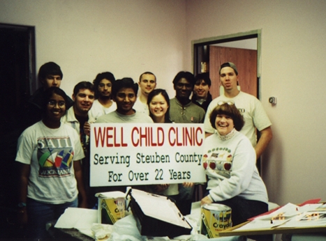 Ms. Judy Marbach poses with the ISA members who helped with the painting