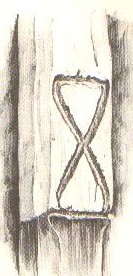 Stiepelteken van boerderij 'n Pas in enterbroek (gem. Wierden). Vervaardigd in 1827. Gestileerde zandloper. Geschilderd in twee kleuren. Getekend in 1955.