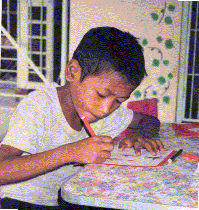 Marlon is one of the streetchildren enrolled in UHF's basic literacy program.
