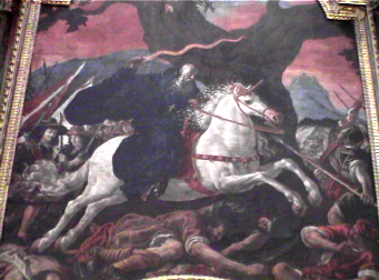 Obra de Rizzi, este lienzo forma parte del retablo de la iglesia de San Milln de Yuso, y conmemora la aparicin de San Milln en  la batalla de Hacinas. 