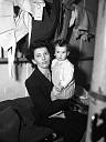 Mother Holding Daughter in Liner Sleeping Quaters