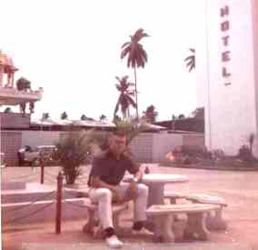Frank/Company Clerk, enjoying the table set up at the foot

 of the little Buddha House outside the Sri Patana Hotel Complex in 1968