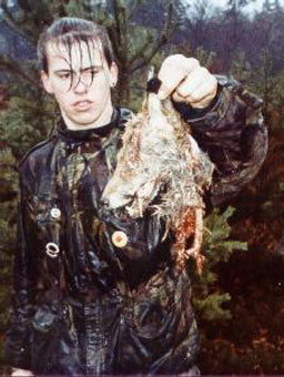 An animal activist shows the remains of a fox hunt