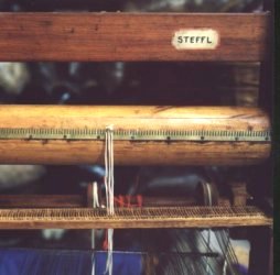 slipping warp knots into slots