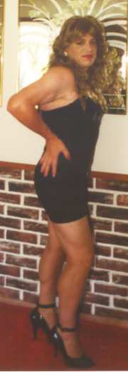 Cynammin in black miniskirted dress