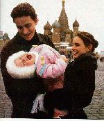 Ekaterina, Sergei, and Dasha in front of Russian buildings in Moscow