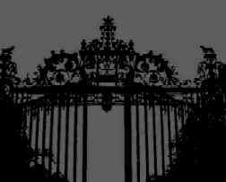 Gregoriu silently walks past the cemetery gates