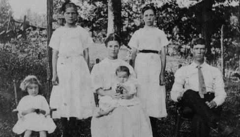 Wheeler Lawson and Family.
Wheeler, age 34, sitting on right.  Wife Sissie (Cobb) in center holding daughter Grace.  Daughter Amanda sitting in chair on far left. Daughter Mollie standing left of Sissie.  Daughter Susan standing right of Sissie.