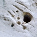 Holes in rock -- possibly from looms