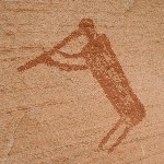 Kokopelli pictograph near small grainery