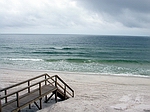 This is a boardwalk going from a house down to the beach.