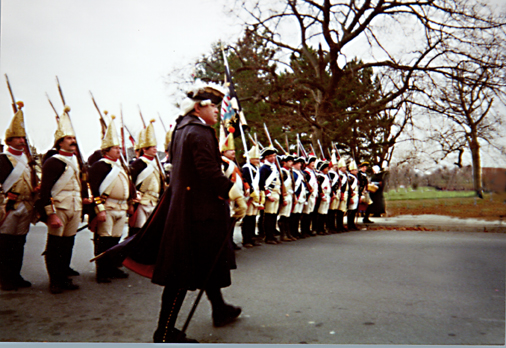 Herr Malit strutting his stuff down the avenue as the Hessian line awaits the rebel throng.