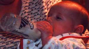 Focused on holding a bottle
