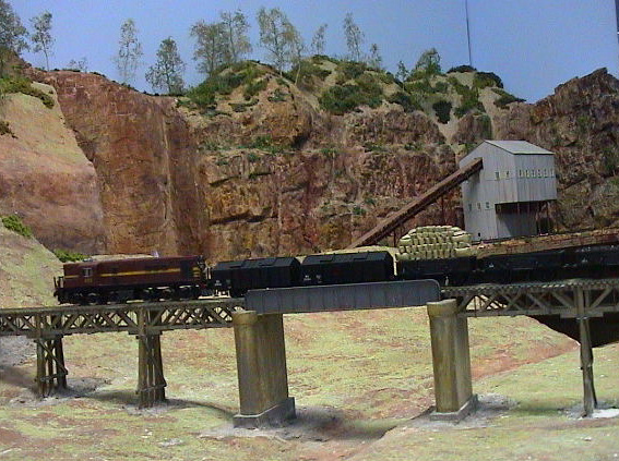 A 48 class loco passes the mine on the club house layout.
