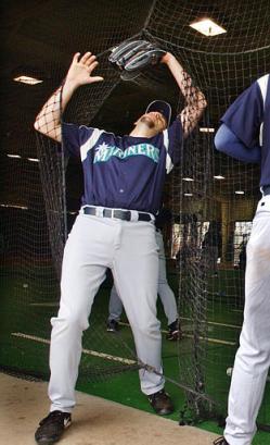 Aaron Looper has a moment with the batting cage net.&nbsp; He'll have his father pull some strings