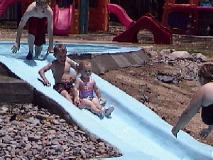 Tabitha, DJ, Travis on the slide
