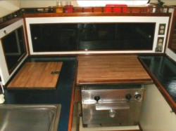 Galley freshened up; teak trim, counters and all; click on shot to see larger pic