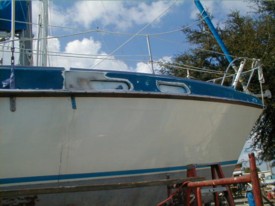 Starboard portlights out and repairs being performed