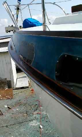 Mahogany rub rail with stainless steel strip for protection