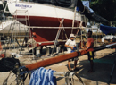 Revarnishing mast and spraying topsides (Thailand)
