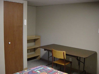south bedroom with desk and closet