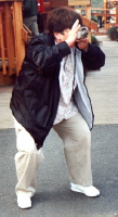 THIS is how to take a picture: Hold the camera level, compose your picture, focus, yell 'smile,' and....SQUAT!