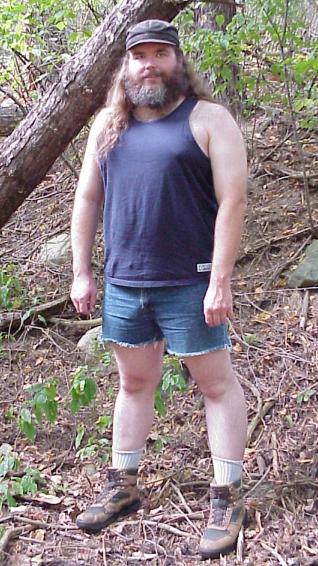 Songdog in woods, with shirt