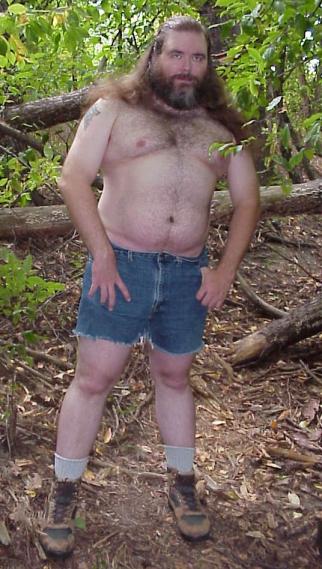 Songdog in woods, without shirt