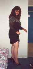 Kendra standing with a black dress on