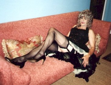 Yellow bouffant petticoat and a black basque
    with suspenders and stockings