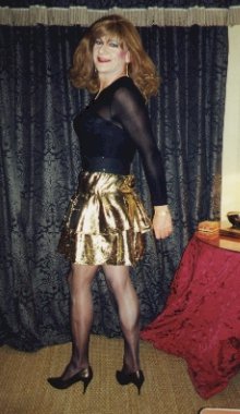 My gold mini-skirt and black see-through body
