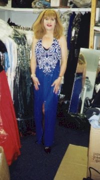 A blue beaded gown with a halter neck