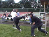 El Nino strikes Grandmasta' Mike quickly with his favorite move, the Hurricane Kick.