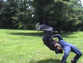 Sinn executes his patented snap-suplex called, the Sinn-plex, on Grandmasta' Mike.