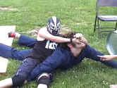 Torment applies one of his favorite moves, the crossface, to Sinn.