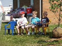 The three boys watching the balloon release