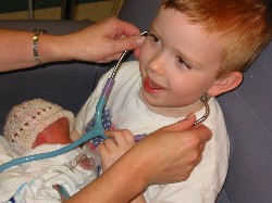 Nathan listening to Abigail's heart