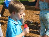 Silas blowing bubbles