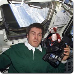 Image: Expedition One Flight Engineer Sergei Krikalev and Reggie Foxworthy taking pictures of the Earth.